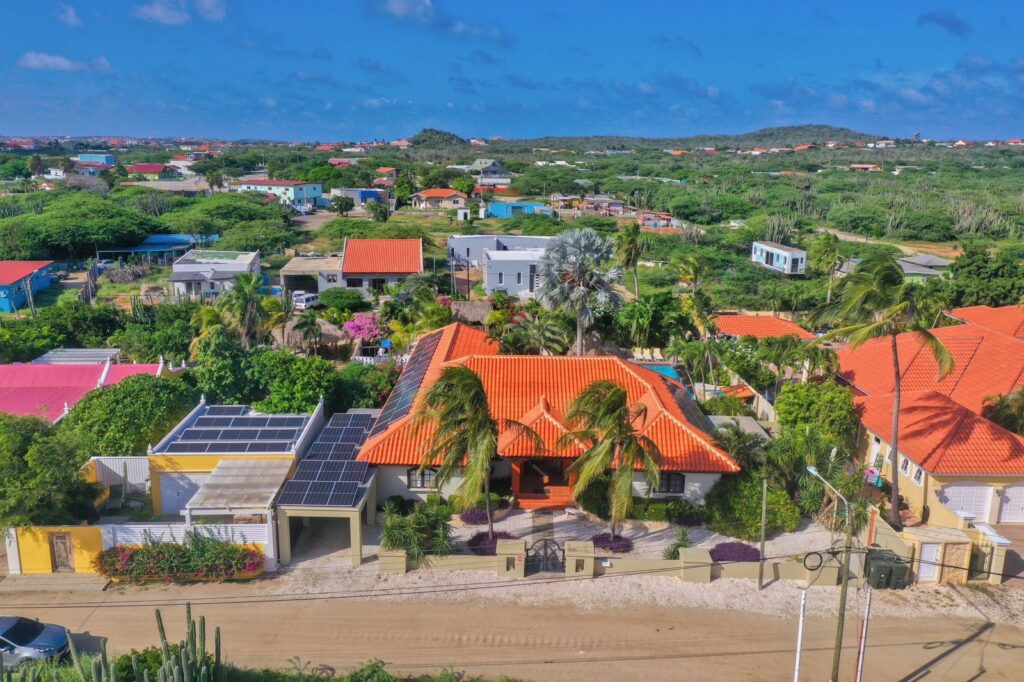 Street-facing aerial view of Villa Nirvana and the Noord landscape