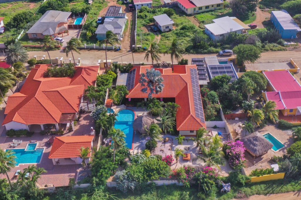 Tropical villas with pools and greenery